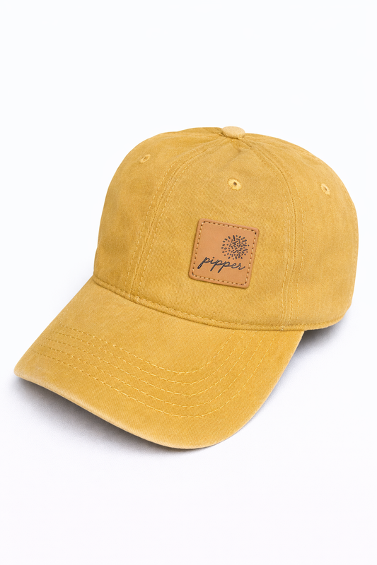 Gorra Origin mostaza con parche de piel
